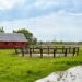 Wooden corral for horse dressage against a blue sky