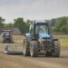 Tractors prepare a racetrack for racing in Denmark.