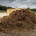 Heap animal dung in farmyard